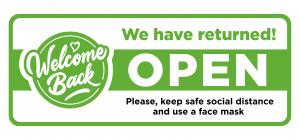 Fun sign on the front door - welcome back! We are open after quarantine due to COVID-19 (coronavirus). Keep social distance.
